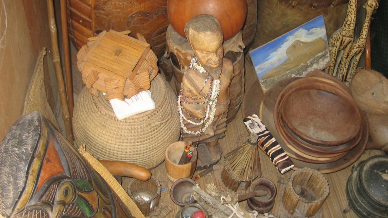 Ancient altar with sacred spiritual objects and ancestral figures